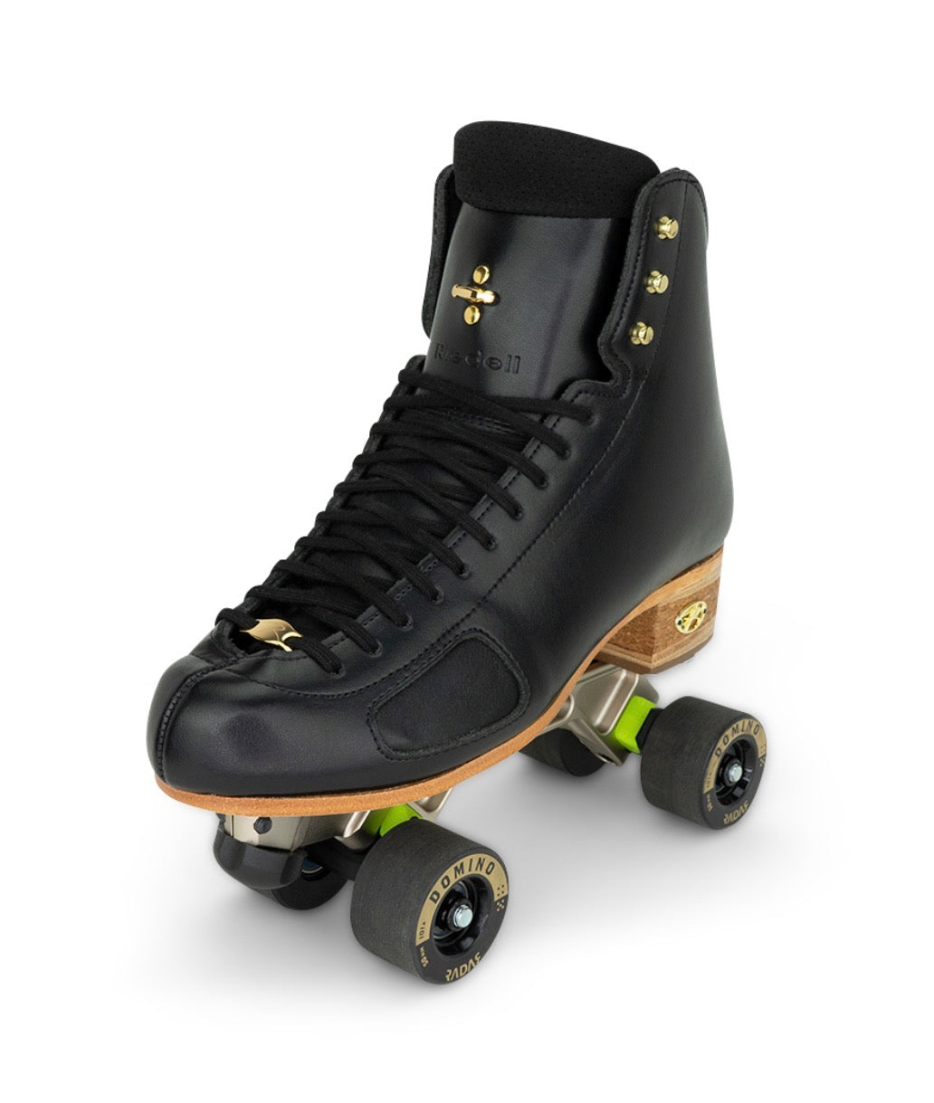 Riedell 910R black leather roller skate boot with gold hardware, black laces,anrius platinum plate and a light wood heel, shown on a white background with its wheels visible.