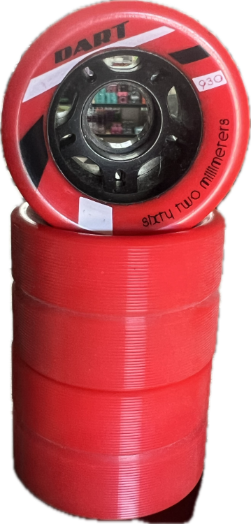 A stack of red DART roller derby wheels, with one wheel shown upright to display its black hub and printed specifications.